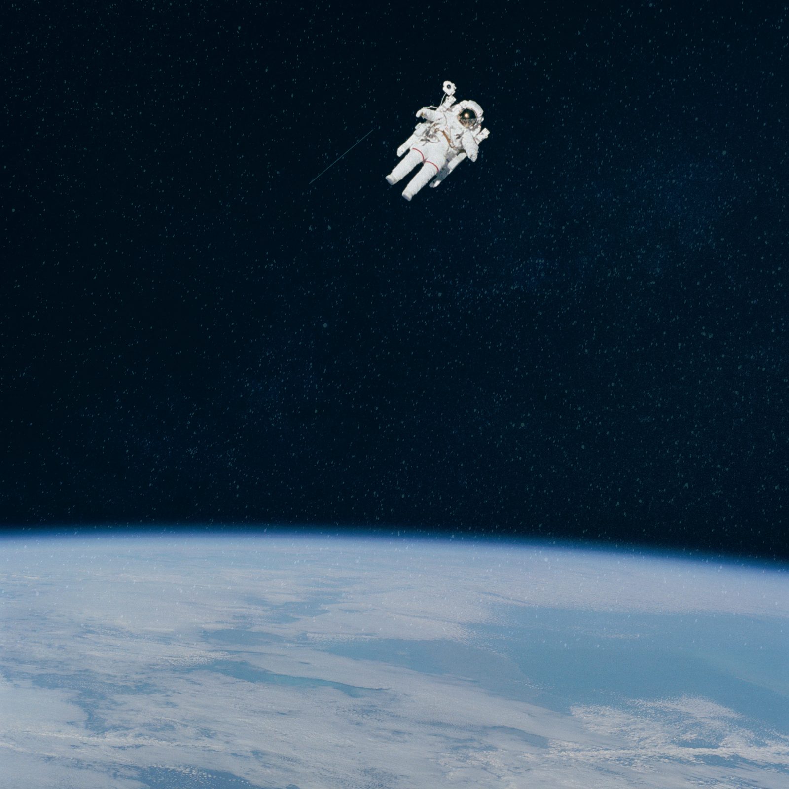 Astronaut on a spacewalk above the Earth